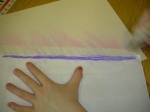 With a paper towel, smudge the chalk onto the envelope paper.
